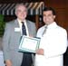 Arayana receives certificate from Dr. Ken Koonce