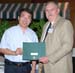 Dr. Qinglin Wu receives "Research Award of Merit" from  Dr. David Boethe
